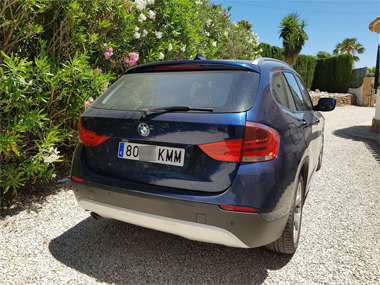 BMW X1 with plates fitted at customers home BMW X1